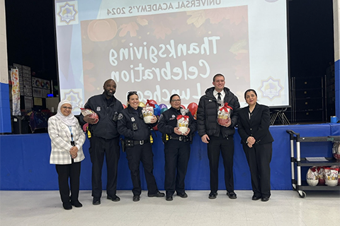 A group photo of professionals honored at Universal Academy at Thanksgiving